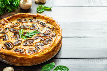 Jellied pie with meat and mushrooms on potato dough