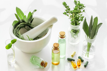 Herbal formulations for health care - herbs and drugs on white background