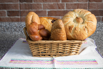 square bread basket with some bread ready for breakfast