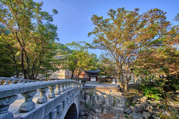 Scenic view of rock bridge and entrance to buddhistic temple in Jirisan national park in Republic of Korea. Beautiful summer sunny look of gate in asian style to religion object in South Korea
