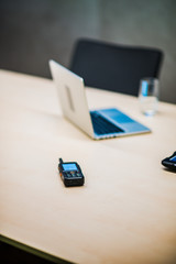 Modern computer and portable transmitter in office.