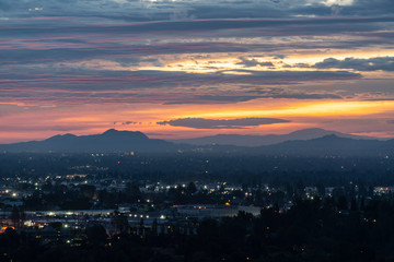 Los Angeles San Fernando Valley dawn with colorful fall clouds.  View towards Griffith Park and the Santa Monica Mountains from the Santa Susana Pass in Chatworth, California. 