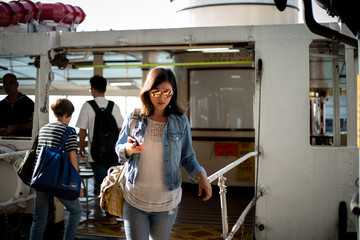 Woman travel Hong Kong by taking ferry