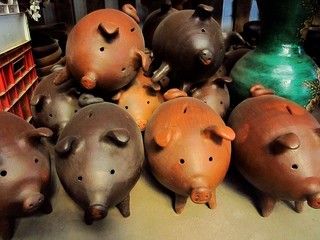 Handicrafts of clay from Pomaire, Chile. Brown piggy bank made with modeling clay