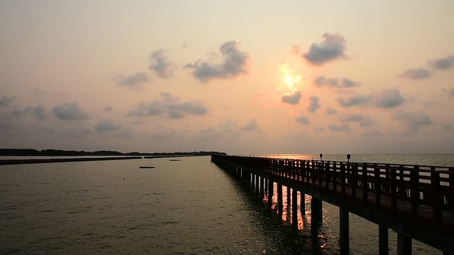 Beautiful sunlight morning sea view and Long red bridge in Samut Sakhon Thailand travel 