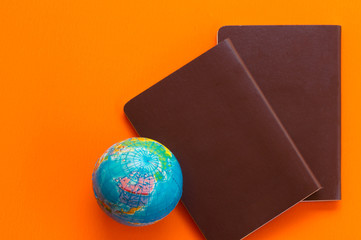 Passport on orange background