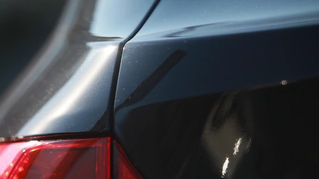 the metal surface of the car and headlight. Blue Pearl paint on the car