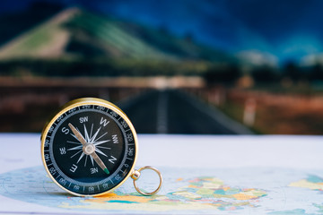close up compass on paper map, travel and lifestyle, manage to success business technology concept.