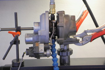 Car turbine repair equipment, turbo compressor on machine tool adjustment close up