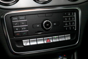 Audio stereo system, control panel and cd in a modern car. Car control panel of audio player and...