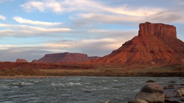 Old west landscape at sunset looking over the Colorado river as sunset in Castle Valley Utah.