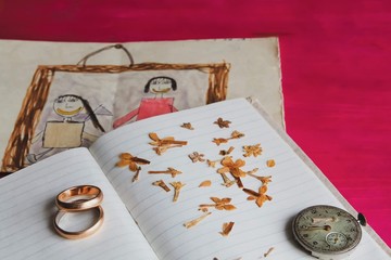 Memory of the heart - old clock dry flowers and children's drawing