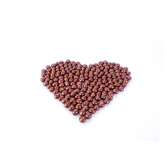 chocolate balls. chocolate balls in love shape on a background