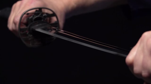 Samurai sword katana in hand. Katana sword holding in Samurai hand prepare to flighting