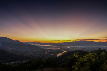 Mountain view misty morning above Kok river and Tha Ton City around with sea of mist and purple sky background, sunrise at Wat Tha Ton, Tha Ton District, Fang, Chiang Mai, northern of Thailand.
