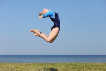 girl gymnast in a blue bodysuit