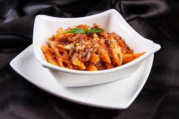 Pasta in a ceramic square bowl