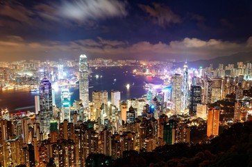 Fototapeta na wymiar Night scenery of Hong Kong viewed from top of Victoria Peak with city skyline of crowded skyscrapers by Victoria Harbour & Kowloon area across the busy seaport ~ Cityscape of Hongkong in blue twilight