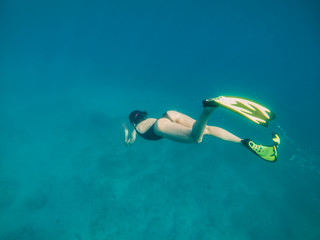 woman in flipper view underwater beach vacation