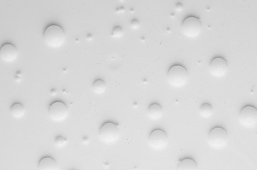 White liquid paint bubbles texture as abstract background.