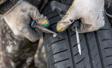 Self-tapping screw on a car wheel