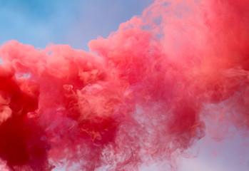 Red smoke on a blue sky