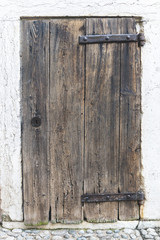 Old wooden door on a street of Arco Italy