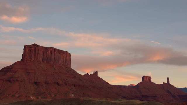 Time lapse at sunset in the old west desert in Utah as the light moves up the cliffs in Castle Valley.
