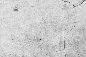 Texture of a concrete wall with cracks and scratches which can be used as a background