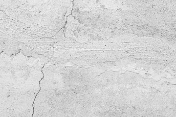 Texture of a concrete wall with cracks and scratches which can be used as a background
