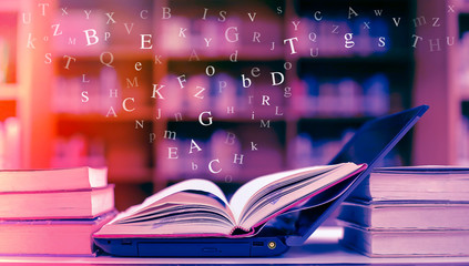 Open book on the table and English alphabet Floating above the book