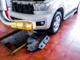 Fototapeta premium closeup of a metal whose of engine oil of vehicle at workshop 