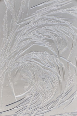Snow patterns on glass as an abstract background