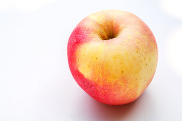 A fresh apple isolated on a white background
