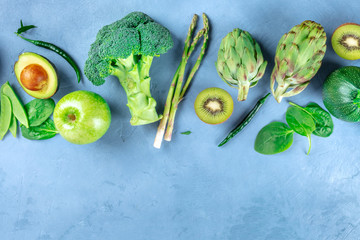 Green fruits and vegetables, detox diet food ingredients, a flat lay shot from the top with copyspace