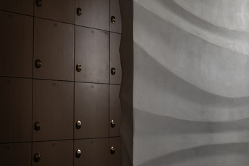 Fitness gym room locker with shift electronic lock on wooden wall background for high security.