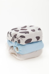 Modern cloth nappy or diaper on white background 