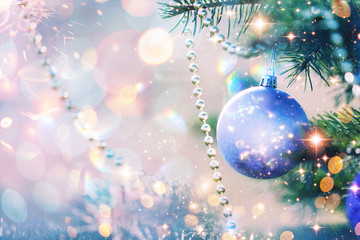 Fototapeta na wymiar Christmas and New Year holidays background. Glitter lights backdrop. Winter season. Text space. Closeup of Christmas-tree. Elements of this Image Furnished by NASA.