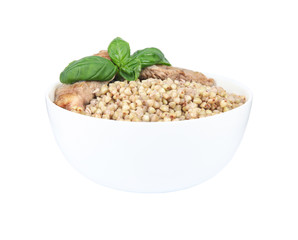 Tasty buckwheat porridge with meat isolated on white