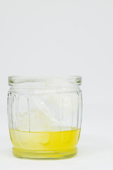 lemon liqueur liquor in glass cup with ice