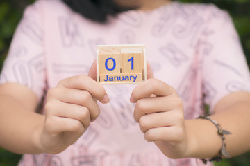 Wooden calendar, dated January 01 in female hands