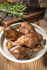 Raw marinated chicken drumsticks.
