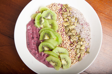 Blueberry smoothie bowl with kiwi fruit 