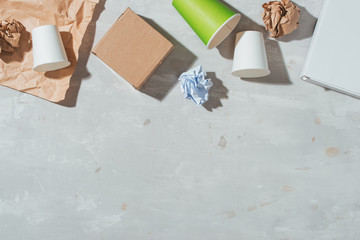 Separate garbage collection: paper bag, egg packing, paper cup. Eco concept. Flat lay