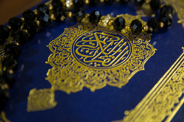 Big Closeup Shot of Beautiful Muslims Holy Book Quran Majid with Tasbeeh Paternoster on it