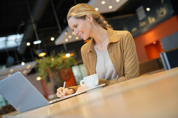 young businesswoman in a cafeteria