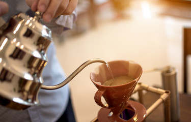 Barista making hot drip coffee, drip brew coffee