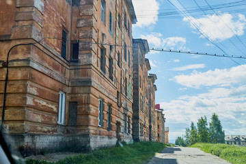 View of the facade of an old red brick house in a city, town or big village