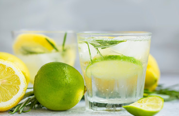 Lime and lemon mojito cocktails, fresh summer drink with ice and rosemary