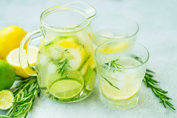 Lime and lemon mojito cocktails, fresh summer drink with ice and rosemary